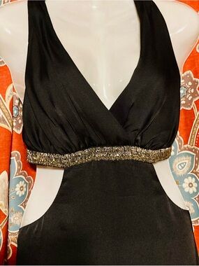 black halter neck with silver/metallic beaded waist and side cutouts